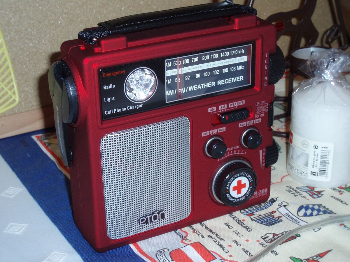 A red Eton FR300 emergency radio with AM, FM and weather bands, a flashlight and a hand crank