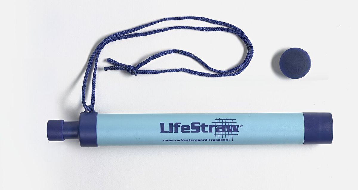 A LifeStraw personal water filter tube with its lanyard and cap
